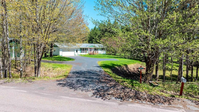 26514 Hendrickson Rd, Calumet, MI 49913 - ranch-style home featuring asphalt driveway and a garage