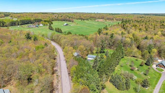 26514 Hendrickson Rd, Calumet, MI 49913 - aerial overview of property's location with a heavily wooded area