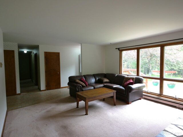 26514 Hendrickson Rd, Calumet, MI 49913 - living room featuring carpet flooring and a baseboard heating unit