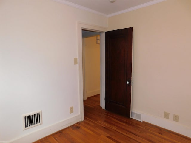 1364 Beaconsfield Ave, Grosse Pointe Park, MI 48230 - empty room featuring wood finished floors, crown molding, and baseboards
