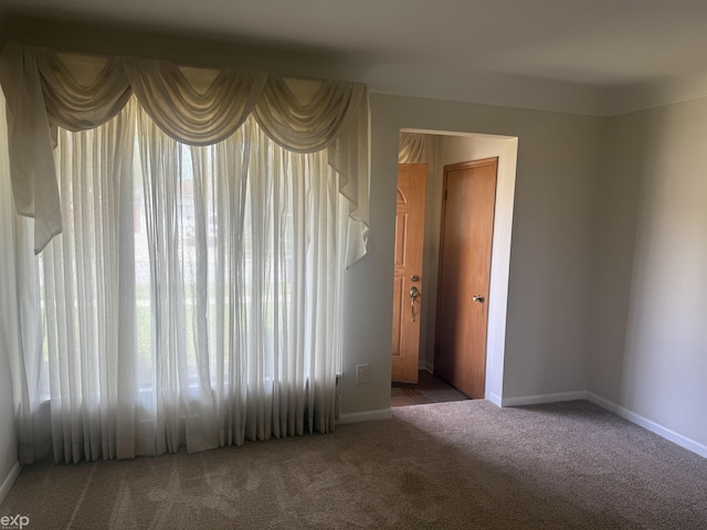 26167 Fairfield Ave, Warren, MI 48089 - carpeted empty room featuring healthy amount of natural light and baseboards