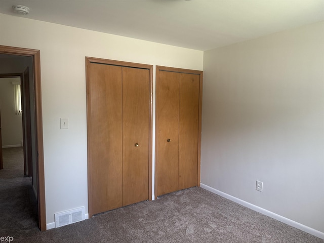 26167 Fairfield Ave, Warren, MI 48089 - unfurnished bedroom featuring carpet floors, multiple closets, and baseboards