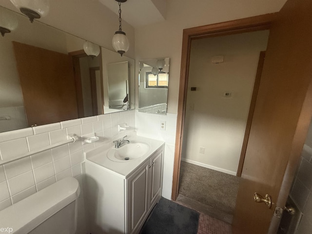 26167 Fairfield Ave, Warren, MI 48089 - bathroom featuring toilet, vanity, and tile walls
