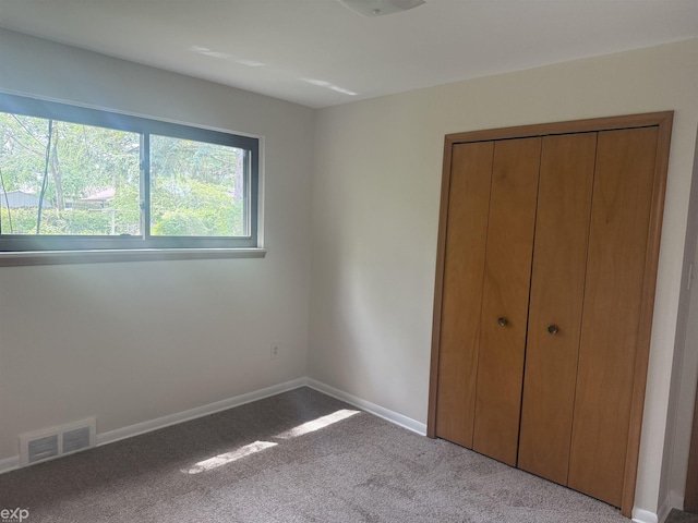 26167 Fairfield Ave, Warren, MI 48089 - unfurnished bedroom with carpet floors, baseboards, and a closet
