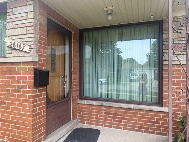 26167 Fairfield Ave, Warren, MI 48089 - doorway to property featuring brick siding