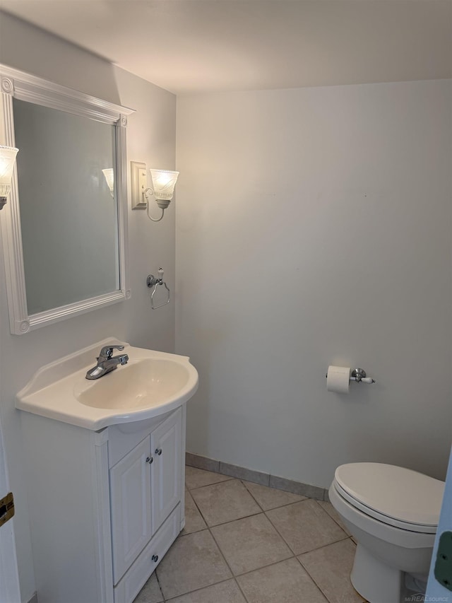 119 Pondview Ct, Brighton, MI 48116 - bathroom featuring vanity, toilet, tile patterned floors, and baseboards