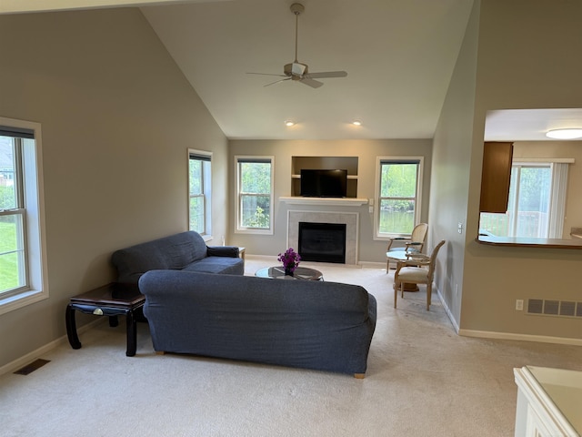 119 Pondview Ct, Brighton, MI 48116 - living area featuring healthy amount of natural light, ceiling fan, light colored carpet, a tiled fireplace, and recessed lighting