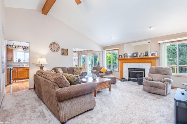 518 Lexington Dr, Rochester Hills, MI 48307 - living area with light carpet, plenty of natural light, beamed ceiling, a tiled fireplace, and high vaulted ceiling