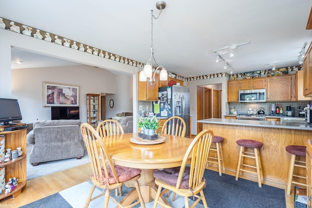 518 Lexington Dr, Rochester Hills, MI 48307 - dining room featuring track lighting and light wood finished floors
