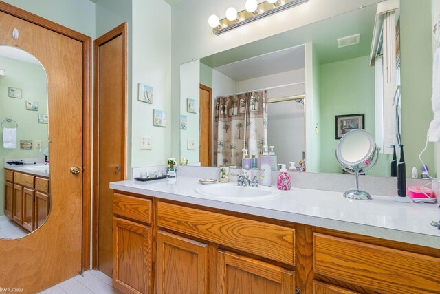 518 Lexington Dr, Rochester Hills, MI 48307 - full bathroom featuring vanity, curtained shower, and tile patterned flooring