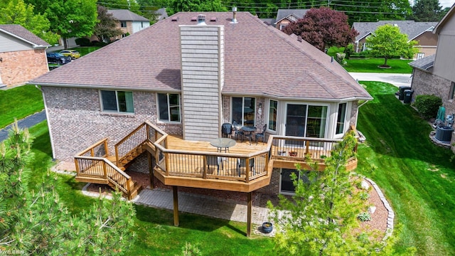 518 Lexington Dr, Rochester Hills, MI 48307 - rear view of property featuring a deck, roof with shingles, a lawn, brick siding, and central AC