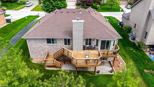 518 Lexington Dr, Rochester Hills, MI 48307 - back of house with a chimney, a wooden deck, a shingled roof, central AC, and brick siding