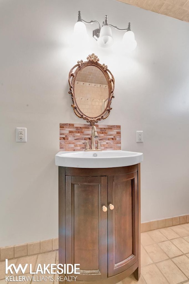 7184 Baker Rd, Worth Twp, MI 48450 - bathroom with vanity, baseboards, and tile patterned flooring