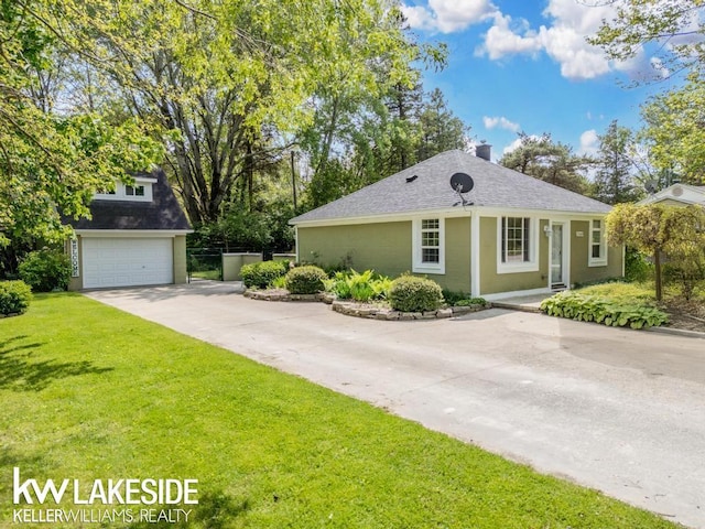 7184 Baker Rd, Worth Twp, MI 48450 - view of front of home with a front yard, roof with shingles, driveway, and a chimney