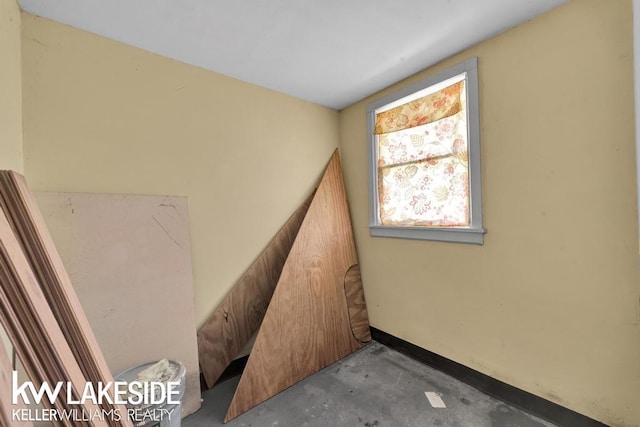 7184 Baker Rd, Worth Twp, MI 48450 - stairway featuring unfinished concrete flooring