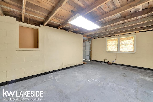 7184 Baker Rd, Worth Twp, MI 48450 - below grade area featuring a garage and concrete block wall