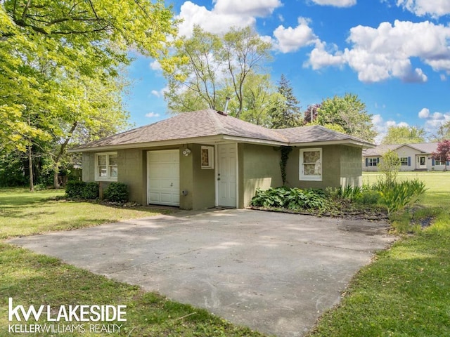 7184 Baker Rd, Worth Twp, MI 48450 - view of front of home with roof with shingles, concrete block siding, and a front lawn