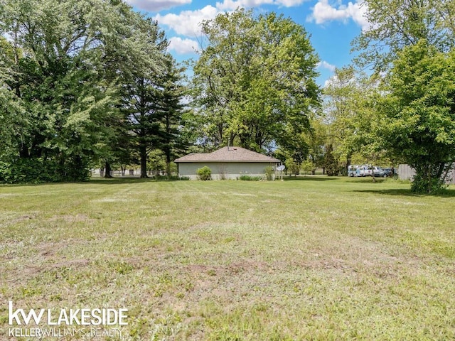 7184 Baker Rd, Worth Twp, MI 48450 - view of grassy yard with view of scattered trees