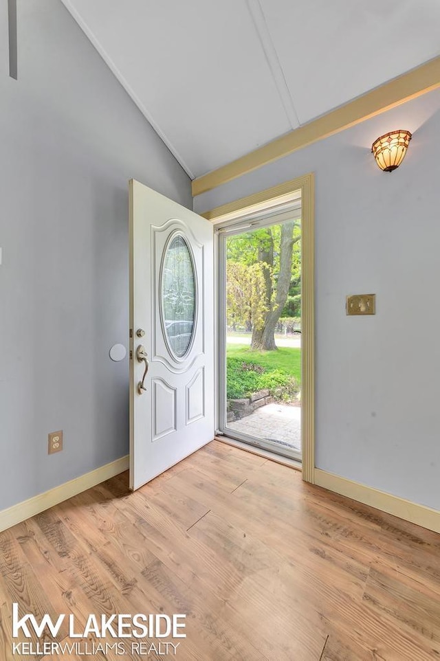 7184 Baker Rd, Worth Twp, MI 48450 - foyer entrance with vaulted ceiling, light wood-type flooring, and baseboards