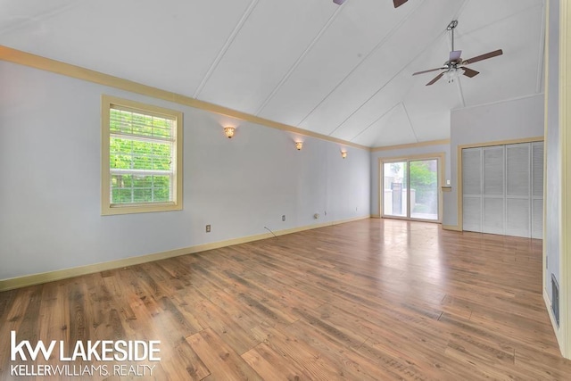 7184 Baker Rd, Worth Twp, MI 48450 - empty room with a ceiling fan, wood finished floors, baseboards, and high vaulted ceiling