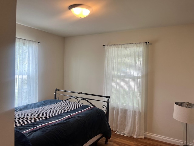 727 Townsend Dr, Algonac, MI 48001 - bedroom featuring wood finished floors and baseboards