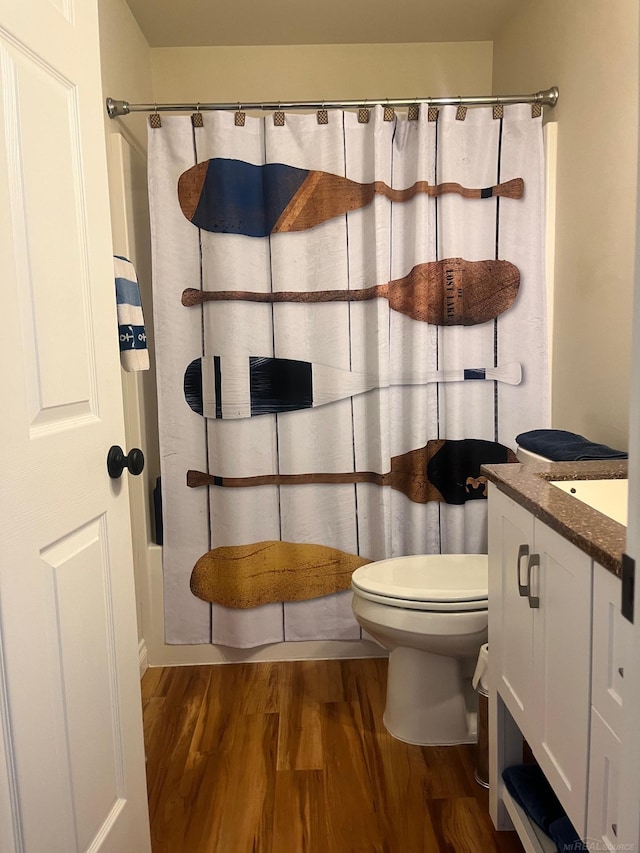 727 Townsend Dr, Algonac, MI 48001 - full bath with wood finished floors, vanity, and toilet