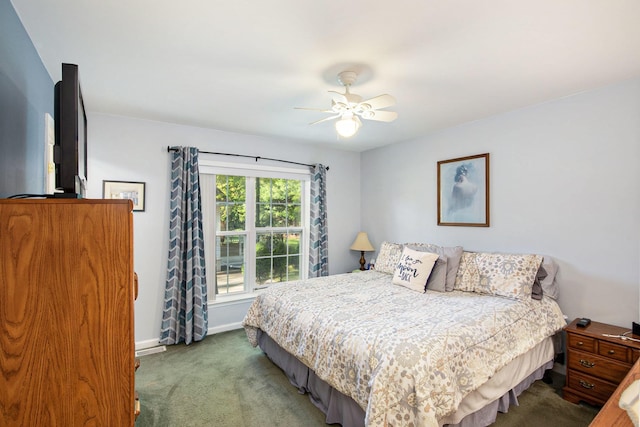 8735 Blackberry Ln, Port Austin, MI 48467 - carpeted bedroom featuring baseboards and a ceiling fan