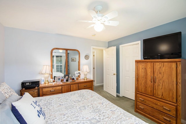 8735 Blackberry Ln, Port Austin, MI 48467 - bedroom featuring light carpet, baseboards, and a ceiling fan