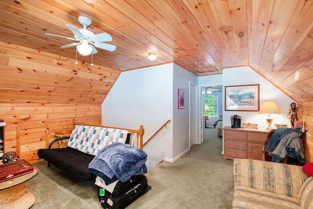 8735 Blackberry Ln, Port Austin, MI 48467 - sitting room featuring wood ceiling, light carpet, vaulted ceiling, ceiling fan, and baseboards