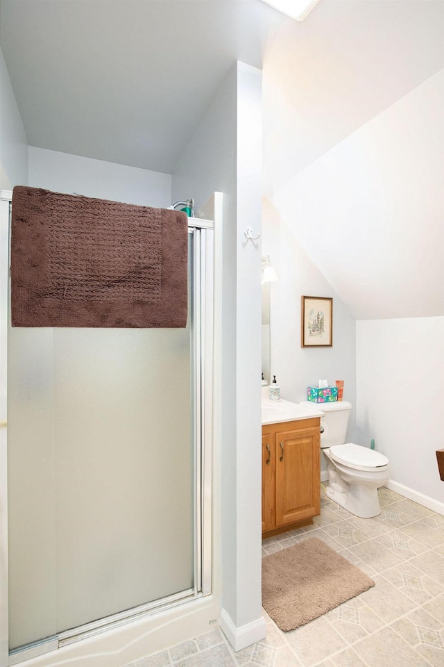 8735 Blackberry Ln, Port Austin, MI 48467 - full bathroom featuring a shower stall, vanity, toilet, lofted ceiling, and baseboards