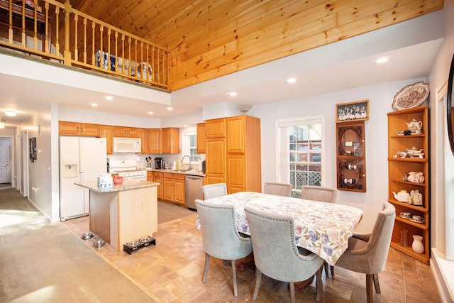 8735 Blackberry Ln, Port Austin, MI 48467 - dining room featuring a high ceiling, wooden ceiling, and recessed lighting