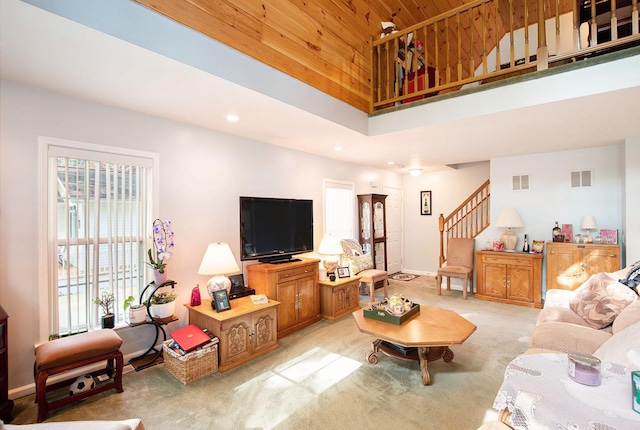 8735 Blackberry Ln, Port Austin, MI 48467 - living area featuring stairway, light colored carpet, recessed lighting, baseboards, and wooden ceiling