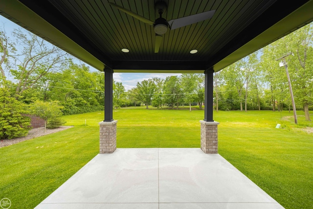16612 Via Villagio Dr, Macomb, MI 48042 - view of patio / terrace with a ceiling fan and view of scattered trees