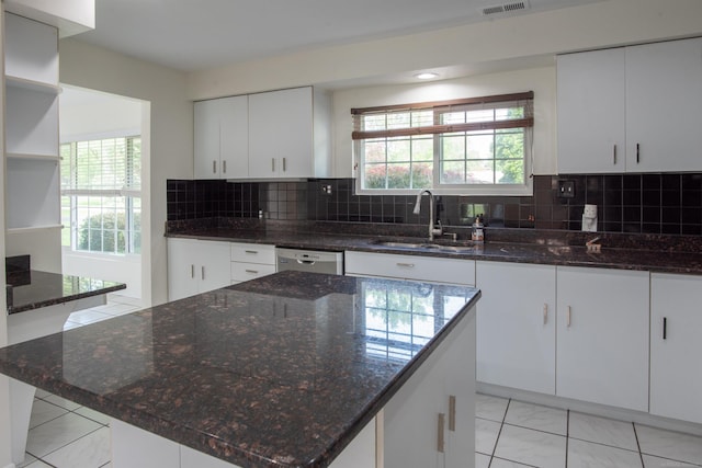 5311 Cambourne Pl, West Bloomfield, MI 48322 - kitchen with a sink, dishwasher, white cabinetry, and dark stone countertops