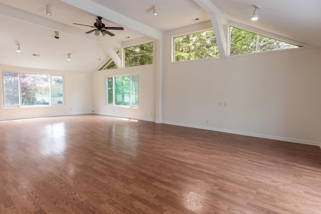 5311 Cambourne Pl, West Bloomfield, MI 48322 - empty room with beamed ceiling, baseboards, wood finished floors, ceiling fan, and high vaulted ceiling