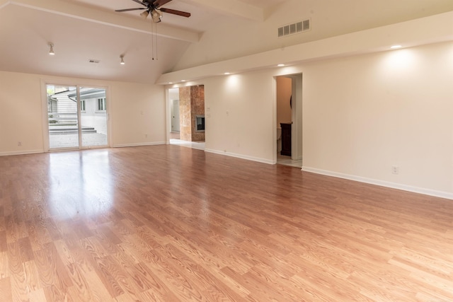 5311 Cambourne Pl, West Bloomfield, MI 48322 - unfurnished living room with beamed ceiling, a ceiling fan, light wood-type flooring, baseboards, and high vaulted ceiling