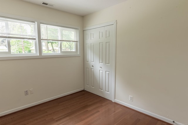 5311 Cambourne Pl, West Bloomfield, MI 48322 - unfurnished bedroom with wood finished floors, baseboards, and a closet