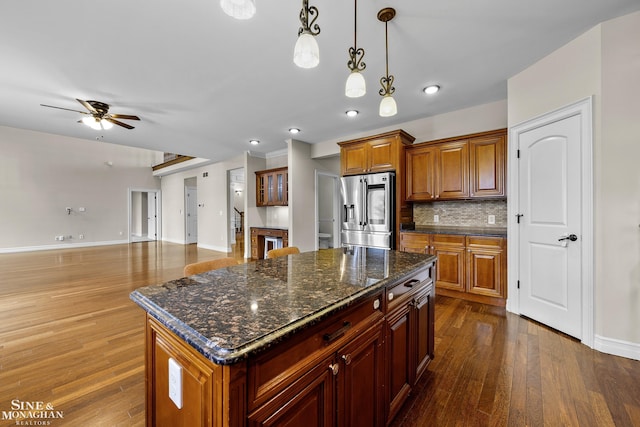 26898 Alderman Ct, Harrison Twp, MI 48045 - kitchen featuring stainless steel refrigerator with ice dispenser, dark wood finished floors, ceiling fan, backsplash, and baseboards