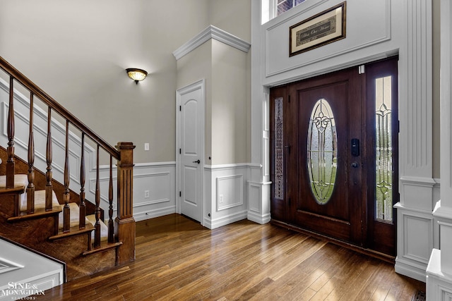 26898 Alderman Ct, Harrison Twp, MI 48045 - foyer entrance with healthy amount of natural light, hardwood / wood-style flooring, stairs, wainscoting, and a towering ceiling