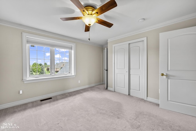 26898 Alderman Ct, Harrison Twp, MI 48045 - unfurnished bedroom featuring light carpet, ornamental molding, baseboards, a closet, and a ceiling fan