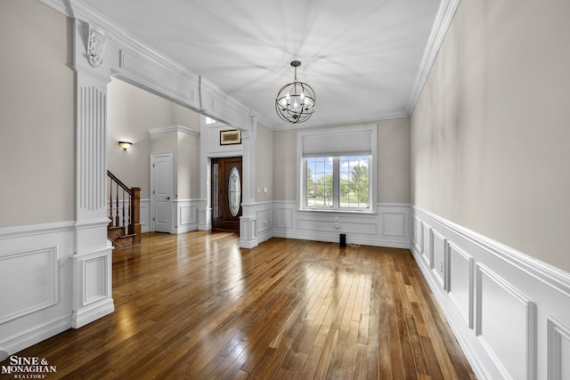26898 Alderman Ct, Harrison Twp, MI 48045 - foyer entrance with a chandelier, dark wood finished floors, stairway, a decorative wall, and wainscoting