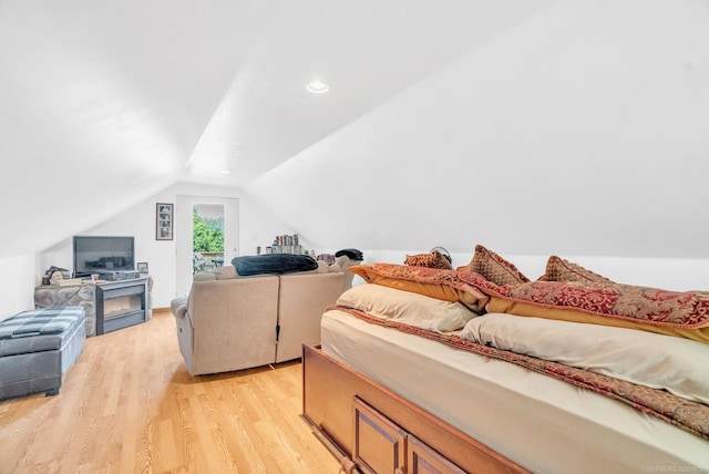 7696 Varty Ct, Lexington, MI 48450 - bedroom with light wood-style floors, lofted ceiling, and access to exterior
