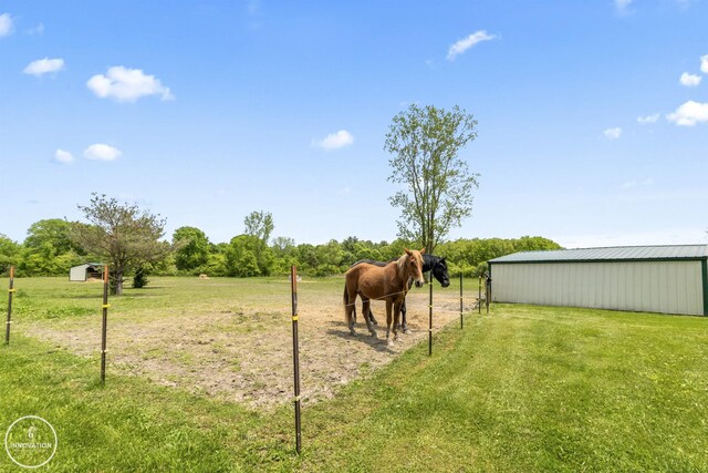 7360 Frith Rd, Saint Clair, MI 48079 - view of grassy yard featuring an outbuilding, a rural view, and a pole building