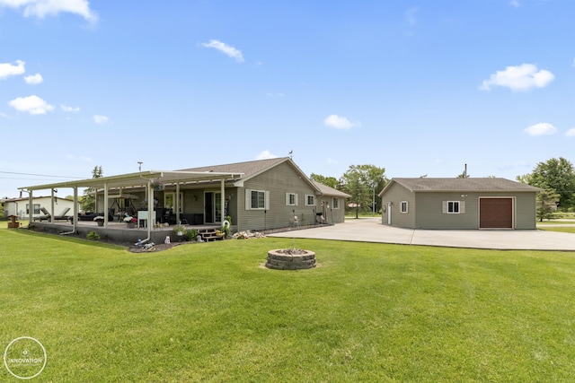 7360 Frith Rd, Saint Clair, MI 48079 - rear view of house with a fire pit, a lawn, and driveway