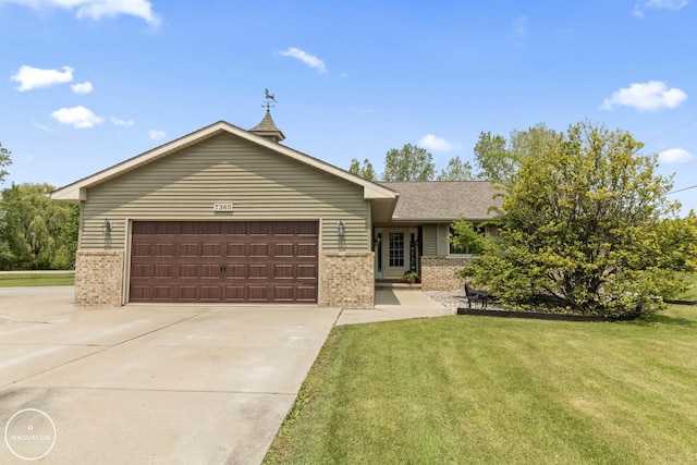 7360 Frith Rd, Saint Clair, MI 48079 - single story home with brick siding, a garage, concrete driveway, a front yard, and roof with shingles