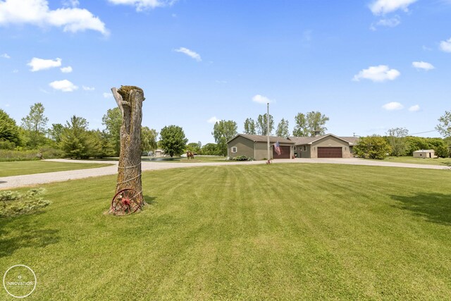 7360 Frith Rd, Saint Clair, MI 48079 - view of front facade with a garage, driveway, and a front yard