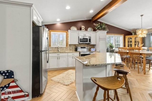 7360 Frith Rd, Saint Clair, MI 48079 - kitchen with appliances with stainless steel finishes, a sink, a chandelier, white cabinets, and recessed lighting