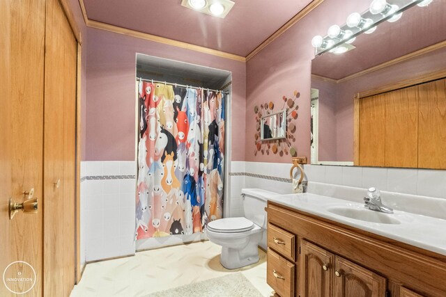 7360 Frith Rd, Saint Clair, MI 48079 - full bath featuring tile walls, vanity, toilet, ornamental molding, and a wainscoted wall