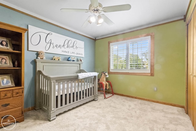 7360 Frith Rd, Saint Clair, MI 48079 - carpeted bedroom with crown molding, baseboards, a crib, and ceiling fan