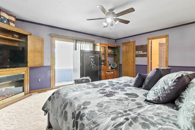 7360 Frith Rd, Saint Clair, MI 48079 - bedroom featuring light carpet, crown molding, a glass covered fireplace, and a ceiling fan